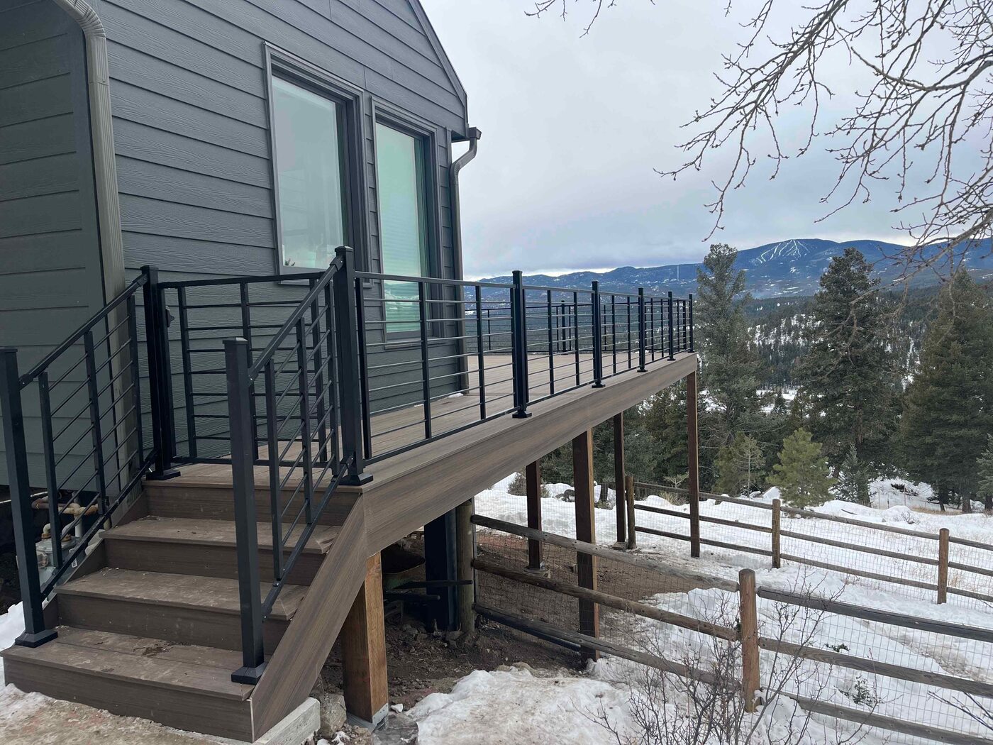 Mountain-view composite deck with stairs in Castle Rock